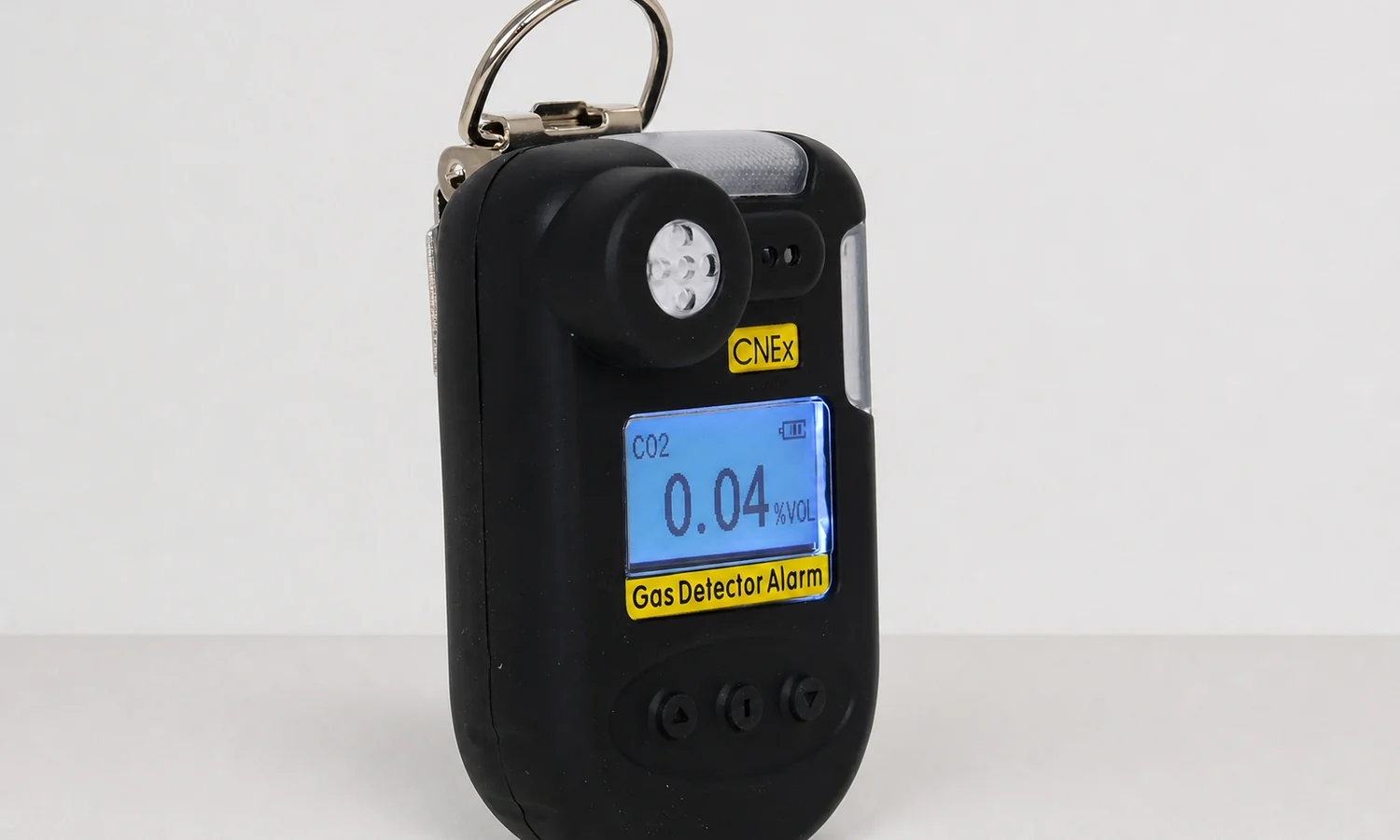Portable carbon dioxide detector showing a percent volume reading on its screen